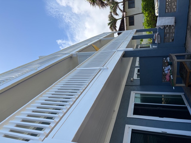 Three-story oceanfront with freshly finished white rails on every floor
